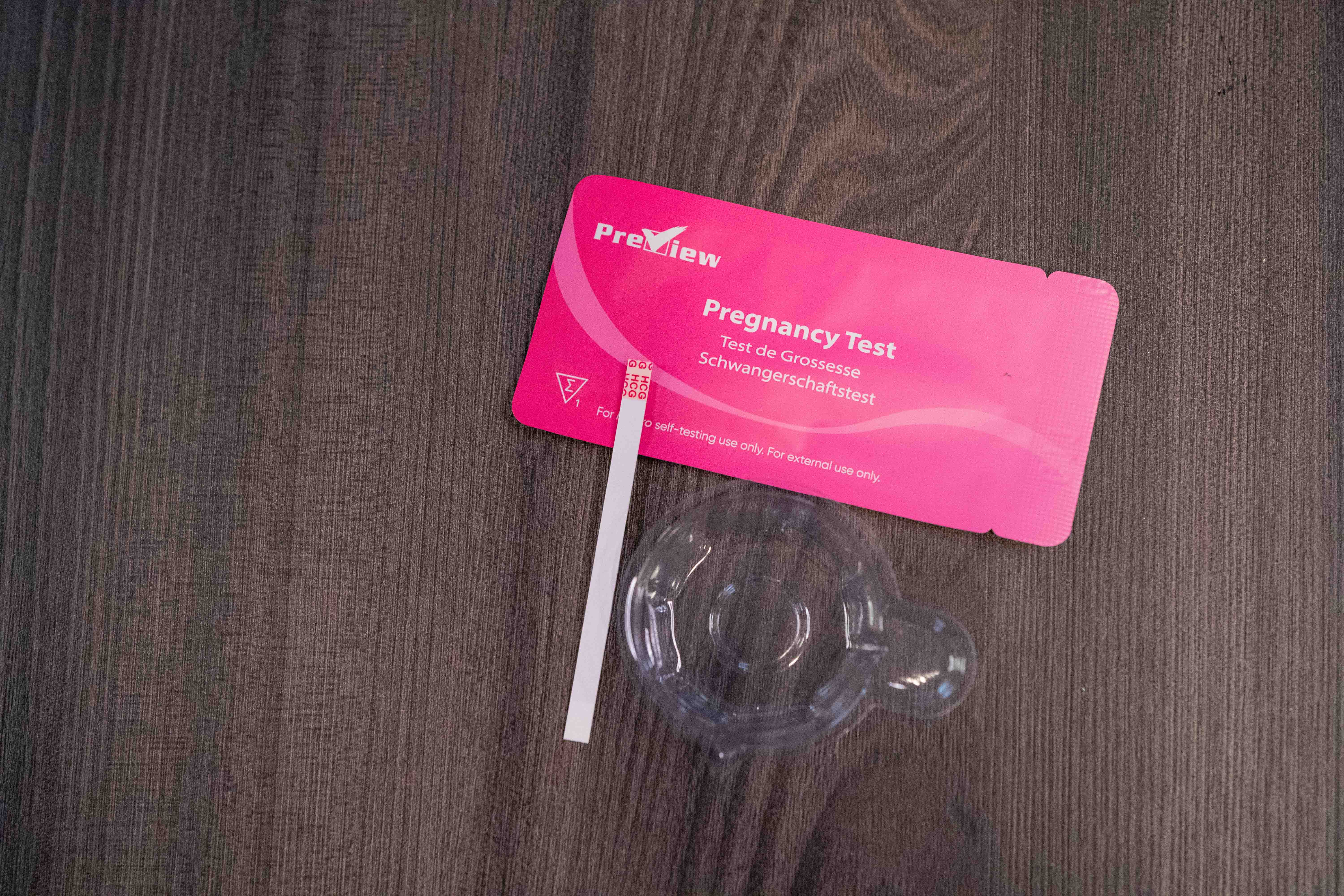 A pregnancy test lay on a table.