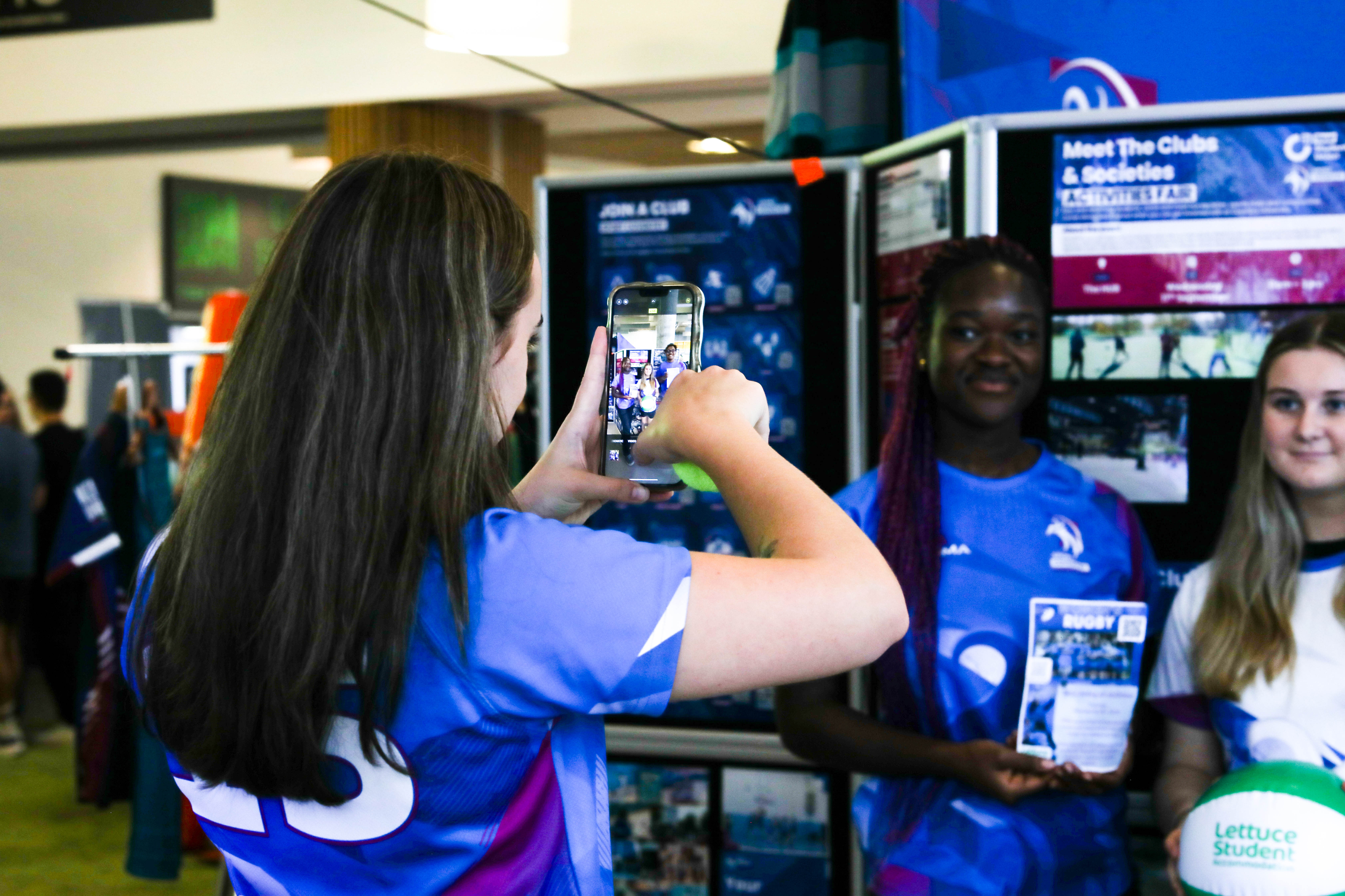 A person taking a photo on their mobile phone.