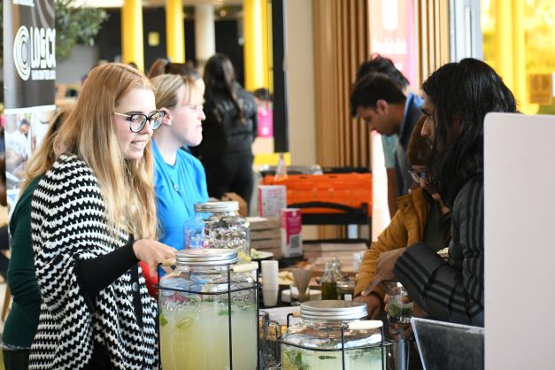 Two students talking over some food.