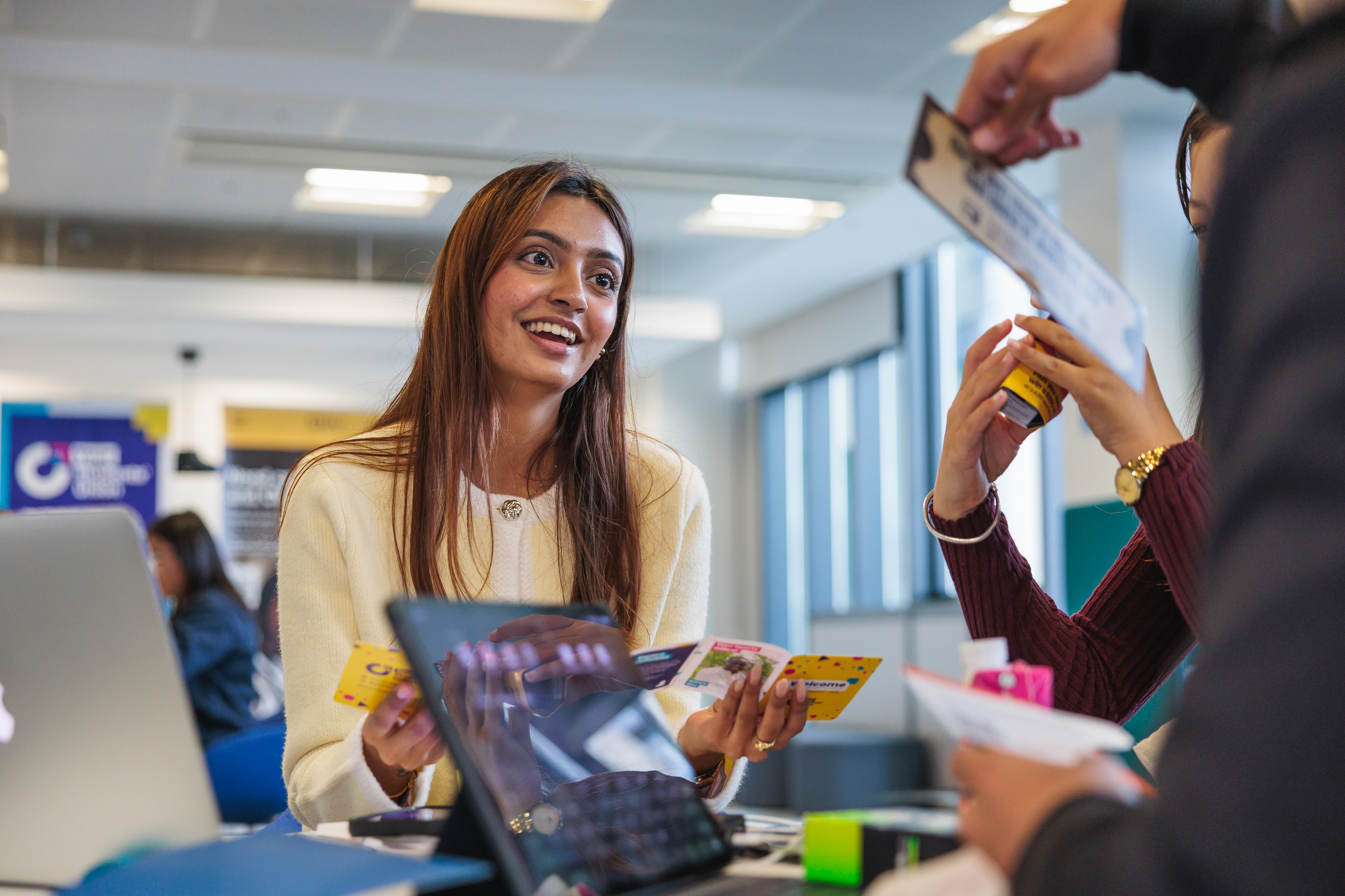 A person sitting down engaging with somebody else.