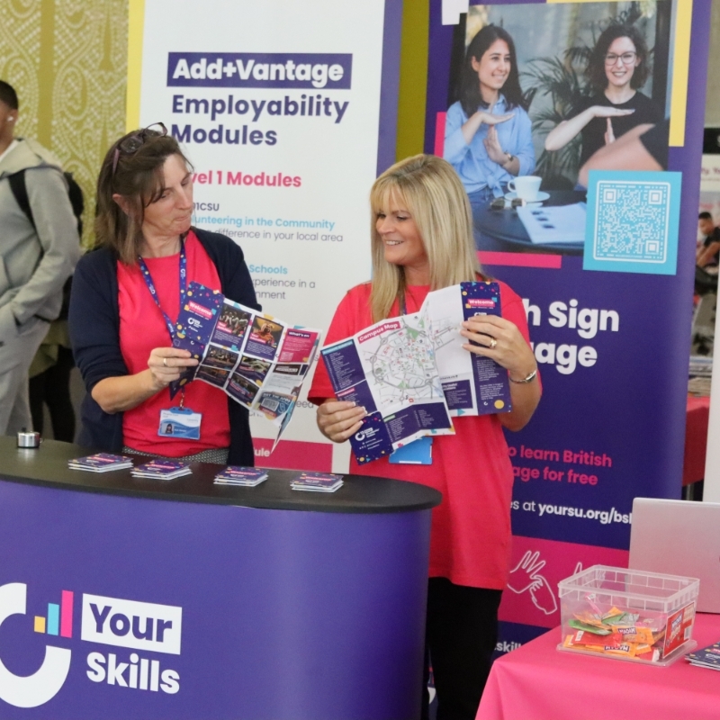 Your SU staff members standing next to Your Skills Add+Vantage Modules stall.